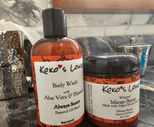 Load image into Gallery viewer, Two Koko's Love products, a body wash bottle and a whipped mango butter jar, on a kitchen counter.
